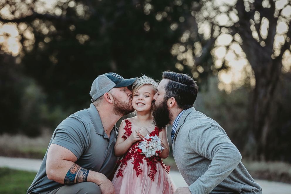 PHOTO: Dylan Lenox (left) is pictured with David Lewis (right) and their daughter Willow (center) before a daddy-daughter dance. 