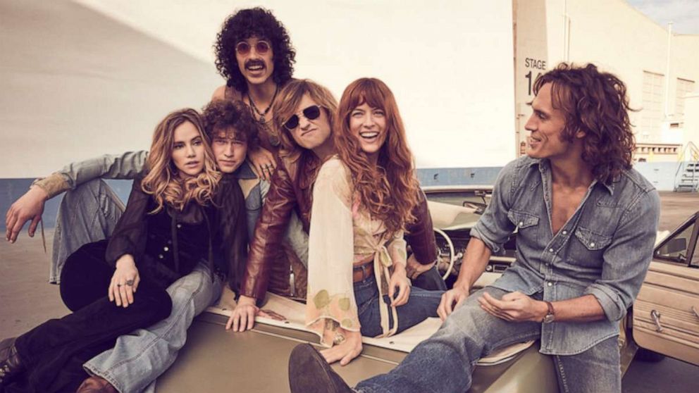 PHOTO: (L-R): Suki Waterhouse (Karen Sirko), Will Harrison (Graham Dunne), Josh Whitehouse (Eddie Roundtree), Sebastian Chacon (Warren Rhodes), Riley Keough (Daisy Jones), Sam Claflin (Billy Dunne)