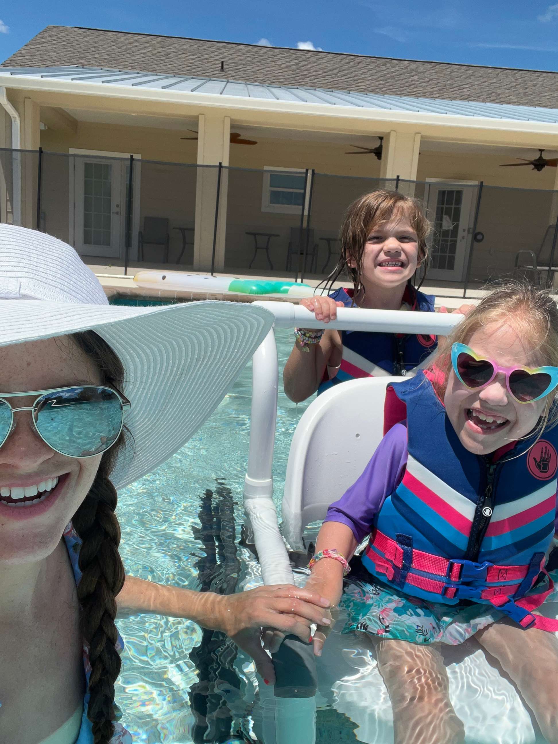 PHOTO: Dallas, her mom, Katrina Placzek, and sister Brooklyn enjoy an accessible swimming pool at Tiff's Place, an accessible vacation home in Florida.
