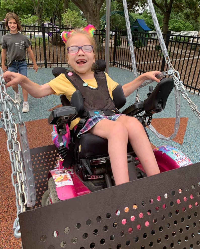 PHOTO: Dallas used a wheelchair swing for the first time in July 2021. This was taken at Pottawatomie Park in St. Charles, IL.
