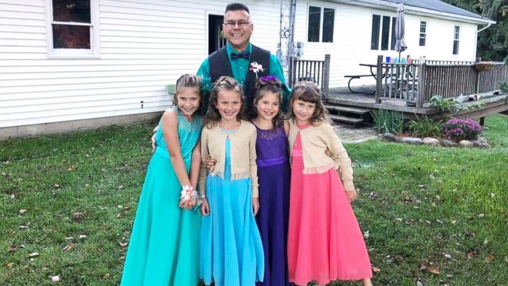 PHOTO: Steve Culbert, a teacher from Davidson, Michigan, escorted his former students Alivia Reece, 7 (in coral) and Avery Reece, 8 (in blue), to the father daughter dance along with his own daughters, Aliyah Culbert, 6 (in purple) and Hailey Culbert, 8.