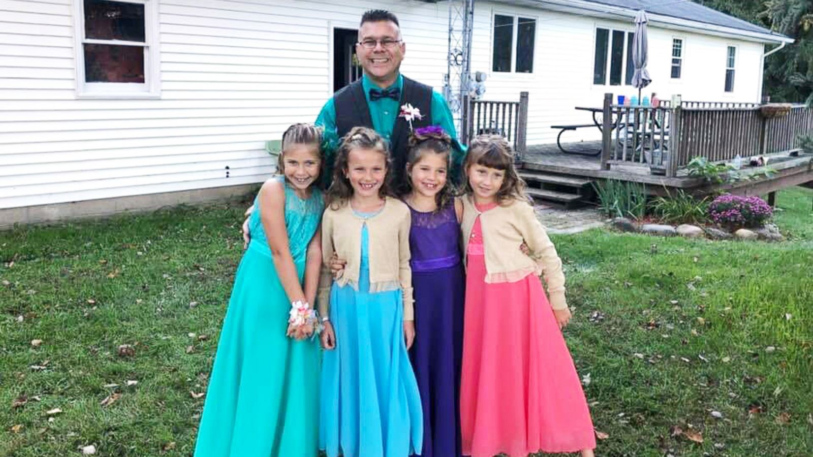 PHOTO: Steve Culbert, a teacher from Davidson, Michigan, escorted his former students Alivia Reece, 7 (in coral) and Avery Reece, 8 (in blue), to the father daughter dance along with his own daughters, Aliyah Culbert, 6 (in purple) and Hailey Culbert, 8.