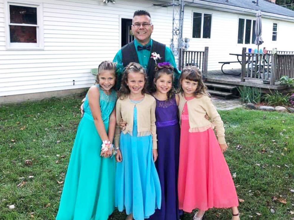 PHOTO: Steve Culbert, a teacher from Davidson, Michigan, escorted his former students Alivia Reece, 7 (in coral) and Avery Reece, 8 (in blue), to the father daughter dance along with his own daughters, Aliyah Culbert, 6 (in purple) and Hailey Culbert, 8.