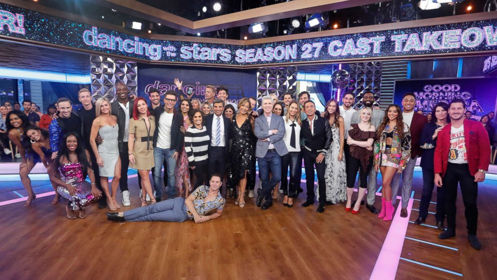 PHOTO: "Good Morning America's" George Stephanopoulos and Ginger Zee pose with the full cast of "Dancing With the Stars" Season 27.