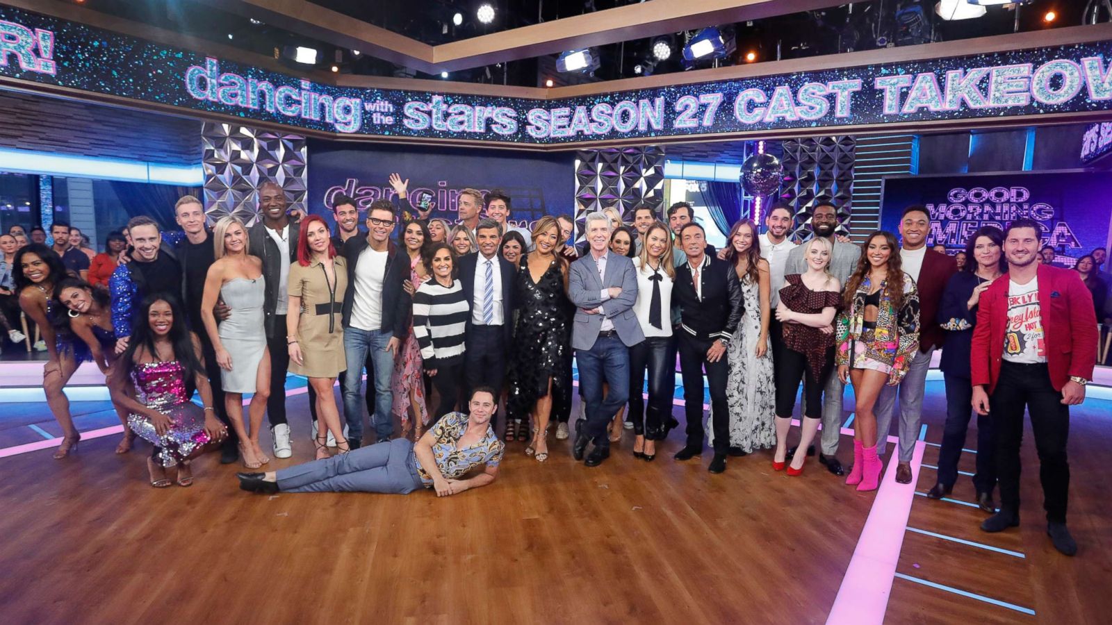 PHOTO: "Good Morning America's" George Stephanopoulos and Ginger Zee pose with the full cast of "Dancing With the Stars" Season 27.