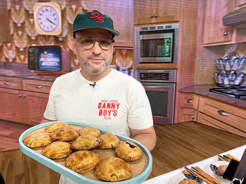 PHOTO: Chef Daniel Holzman with a platter of hand pies. 