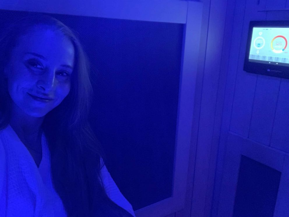 PHOTO: Danielle O'Brien sits inside a sauna at ReCOVER in New York City.