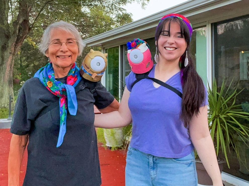 PHOTO: Danielle Boyer poses with her grandmother, both wearing her invention the SkoBot on their shoulders.