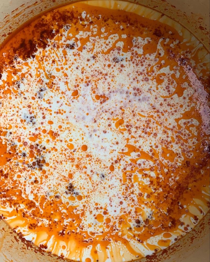 PHOTO: Ingredients for vodka sauce cook down in a Dutch oven.