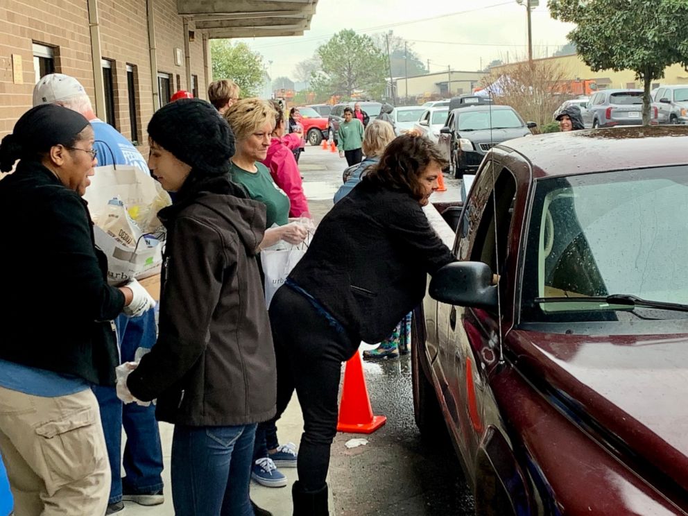 PHOTO: Volunteers and staff at Harvest Hope Food Bank in Richland County, S.C., distribute food at a drive-up distribution center.