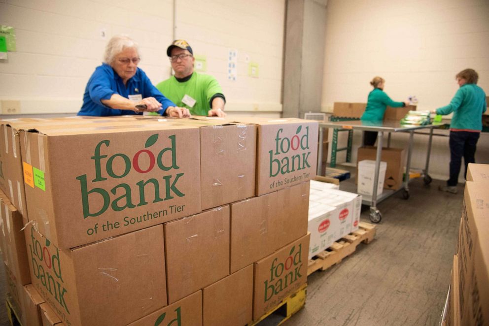 PHOTO: Volunteers at Food Bank of the Southern Tier in Upstate New York prepare  emergency food boxes for drop and go delivery at Mobile Food Pantry sites and for distribution through regional school districts.