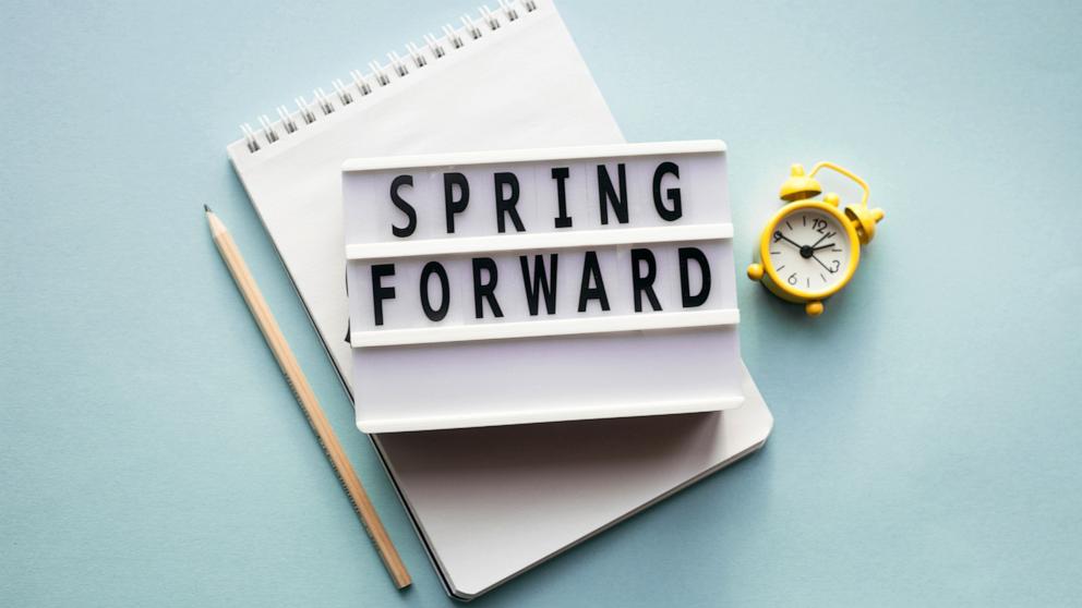 PHOTO: Stock photo of alarm clock, pen and notepad.