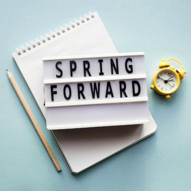 PHOTO: Stock photo of alarm clock, pen and notepad.