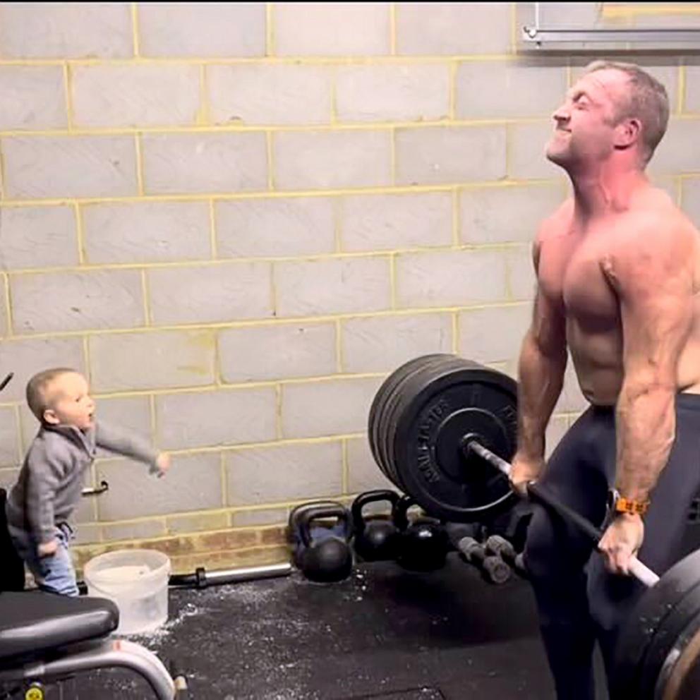 VIDEO: Adorable toddler cheers on his bodybuilder dad lifting weights