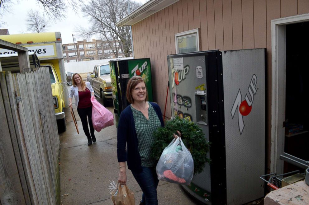 PHOTO: Lynne Hilton, right, and Jenni DeWitt prepare to donate items from their homes.