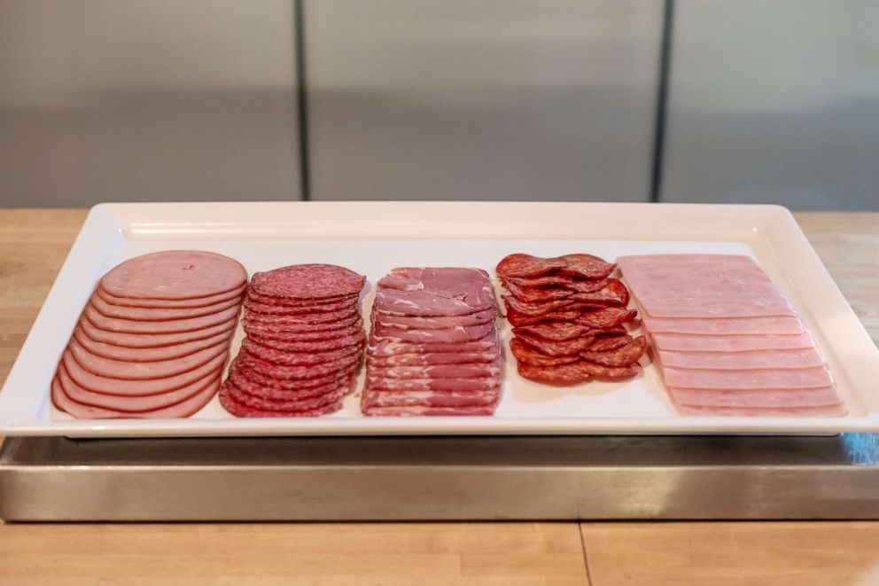 PHOTO: Slices various type of meat, sausage, salami and hams on white tray.