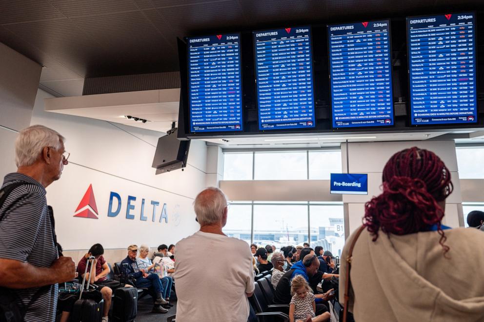 PHOTO: Travelers wait to board their delayed flight at the Hartsfield-Jackson Atlanta International Airport on July 23, 2024 in Atlanta, Georgia.