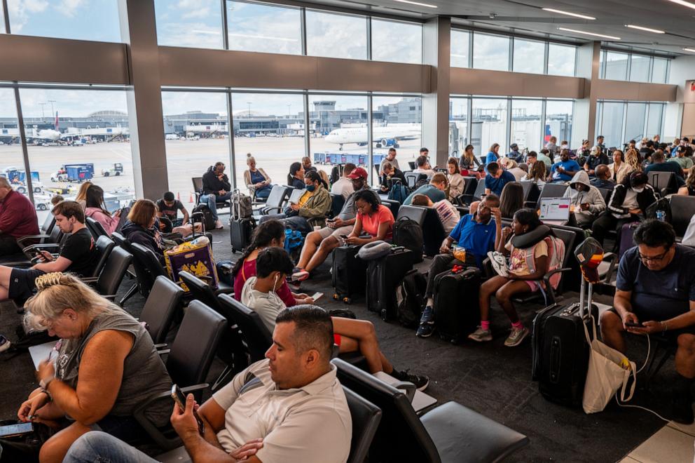 PHOTO: Travelers wait to board their delayed flight at the Hartsfield-Jackson Atlanta International Airport on July 23, 2024 in Atlanta, Georgia.