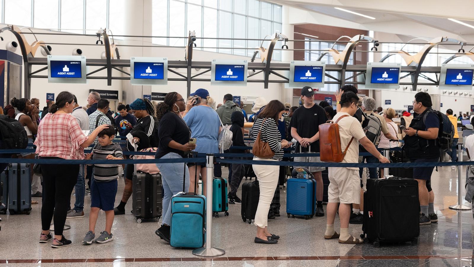 PHOTO: Delta passengers line up to talk with ticketing agents after cancelled and delayed flights at Hartsfield-Jackson Atlanta International Airport on July 22, 2024 in Atlanta, Georgia.