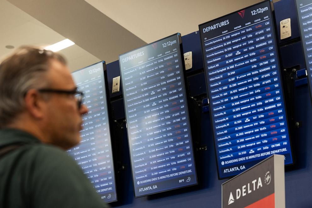 PHOTO: Delta Airlines flights status are displayed for passengers at Hartsfield-Jackson Atlanta International Airport on July 22, 2024 in Atlanta, Georgia.