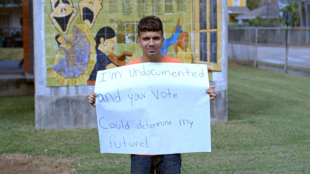 PHOTO: Undocumented student Dennis Rivera holds a sign in Houston, TX.