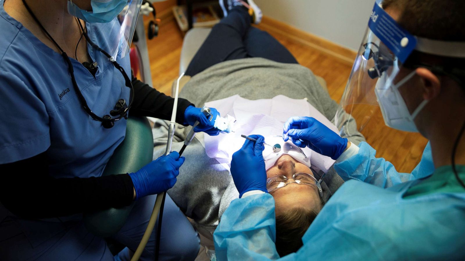 PHOTO: Dentists preform an oral procedure as Ohio implements phase one of reopening dentists, following the outbreak of the coronavirus disease (COVID-19), in Columbus, May 1, 2020.