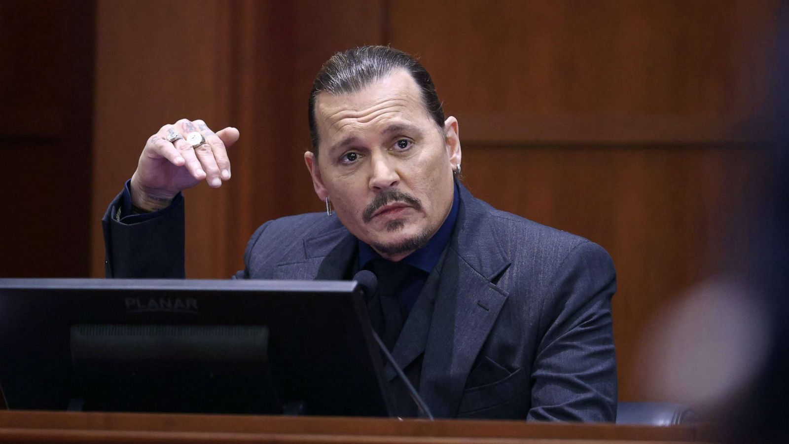 PHOTO: Actor Johnny Depp testifies during his defamation trial against his ex-wife Amber Heard, at the Fairfax County Circuit Courthouse in Fairfax, Va., April 21, 2022.