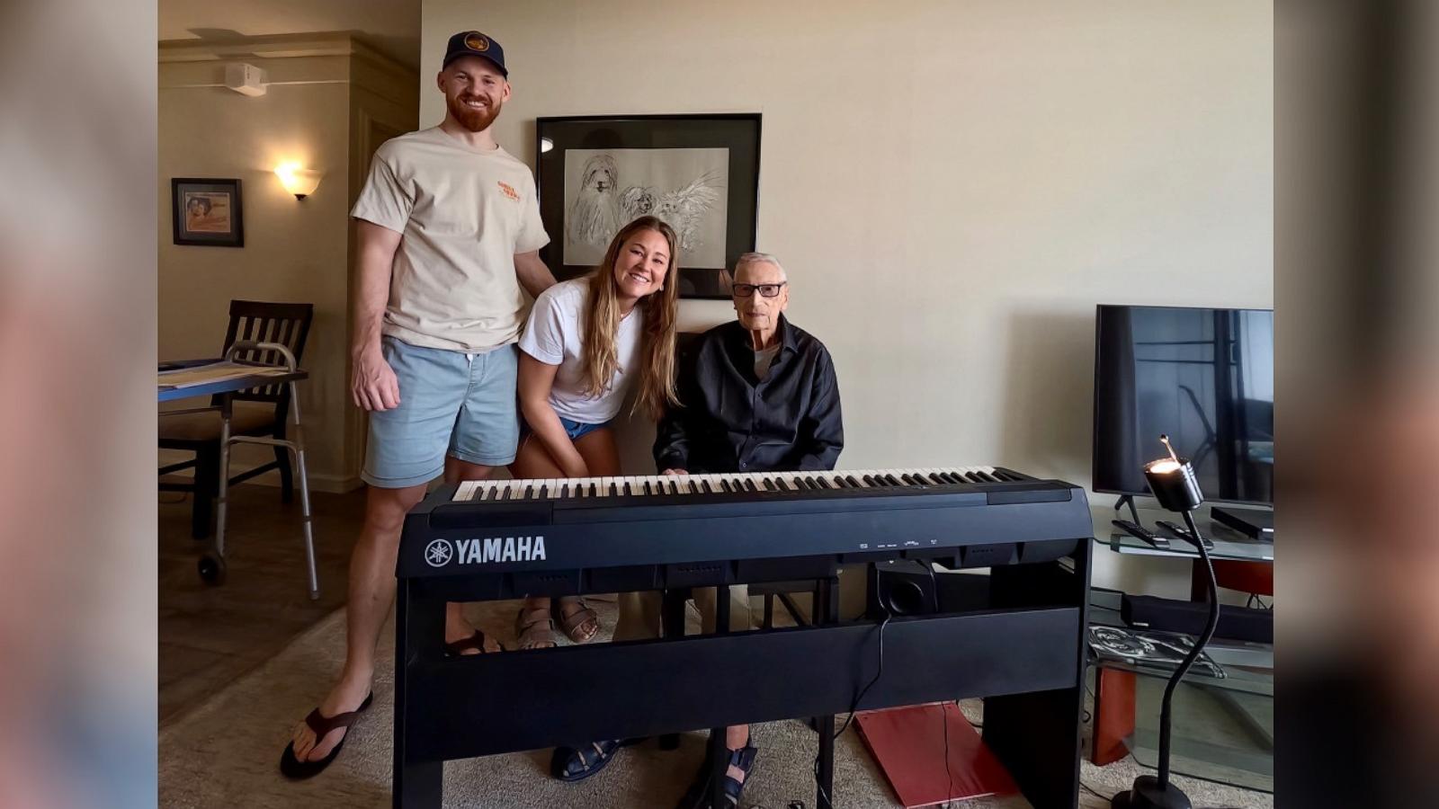 PHOTO: Lydia Pender, 32, and Andy Pender, 33, with their neighbor Derek Peart, 97.