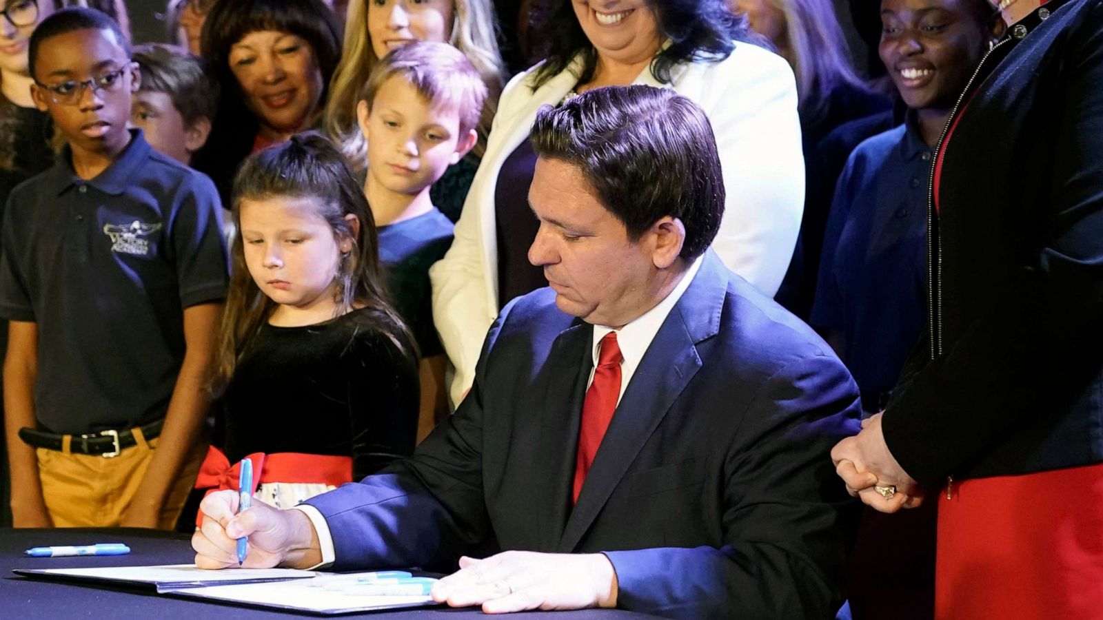 PHOTO: Florida Gov. Ron DeSantis signs a 15-week abortion ban into law, Thursday, April 14, 2022, in Kissimmee, Fla.