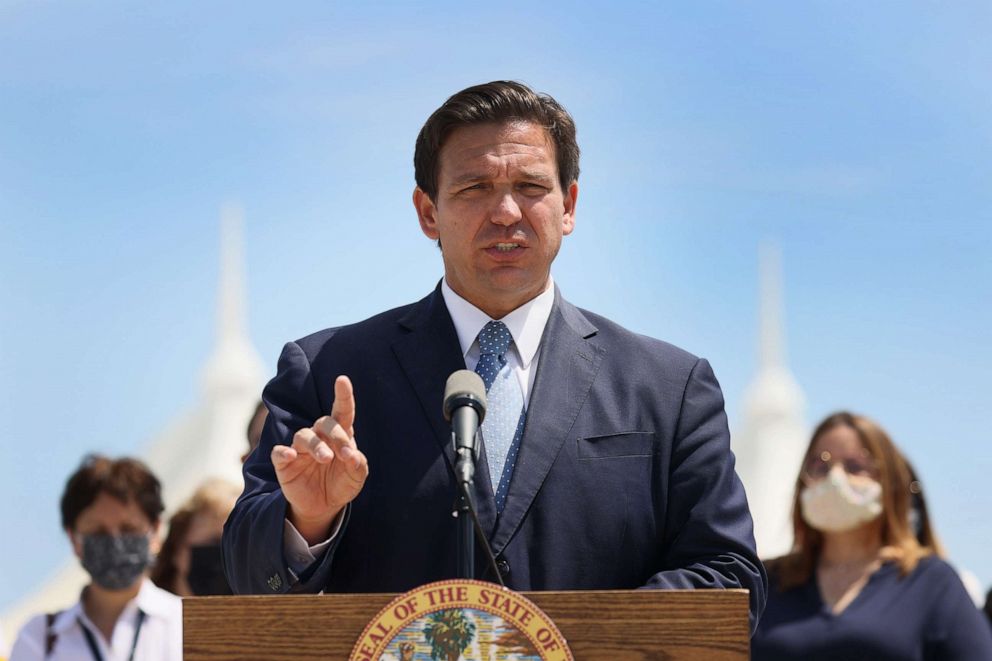 PHOTO: Florida Gov. Ron DeSantis announces Florida is suing the federal government to allow cruises to resume in the state at a press conference at PortMiami on April 08, 2021, in Miami.