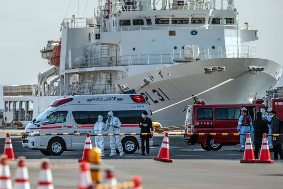 PHOTO: An ambulance carries a coronavirus victim from the Diamond Princess while it is docked at Daikoku Pier, as the ship remains in quarantine after a number of the 3,700 people on board came down with the virus, Feb. 6, 2020 in Yokohama, Japan.