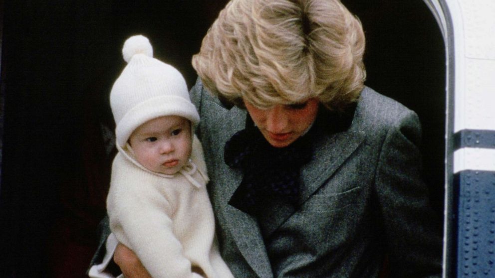 PHOTO: Diana, Princess of Wales carries her son, Prince Harry, off a flight at Aberdeen Airport, Scotland.
