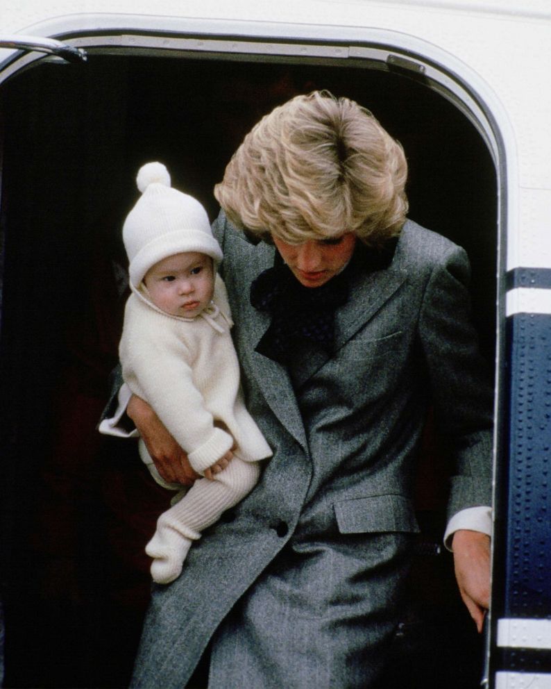 PHOTO: Diana, Princess of Wales carries her son, Prince Harry, off a flight at Aberdeen Airport, Scotland.