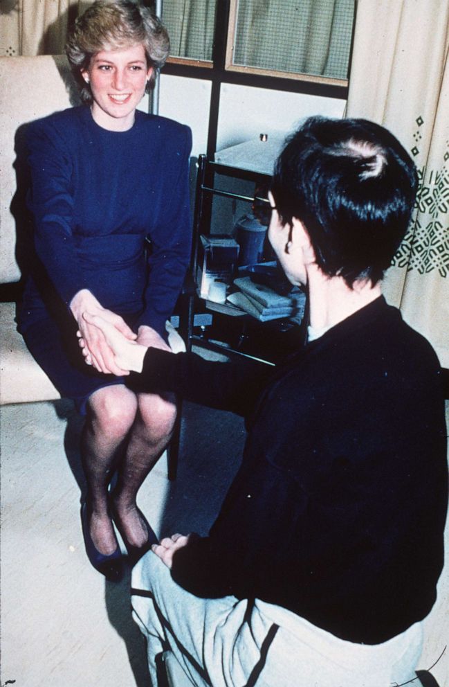PHOTO: Diana, Princess of Wales shakes hands with an Aids victim as she opens a new Aids ward at the Middlesex Hospital on April 9, 1987 in London.