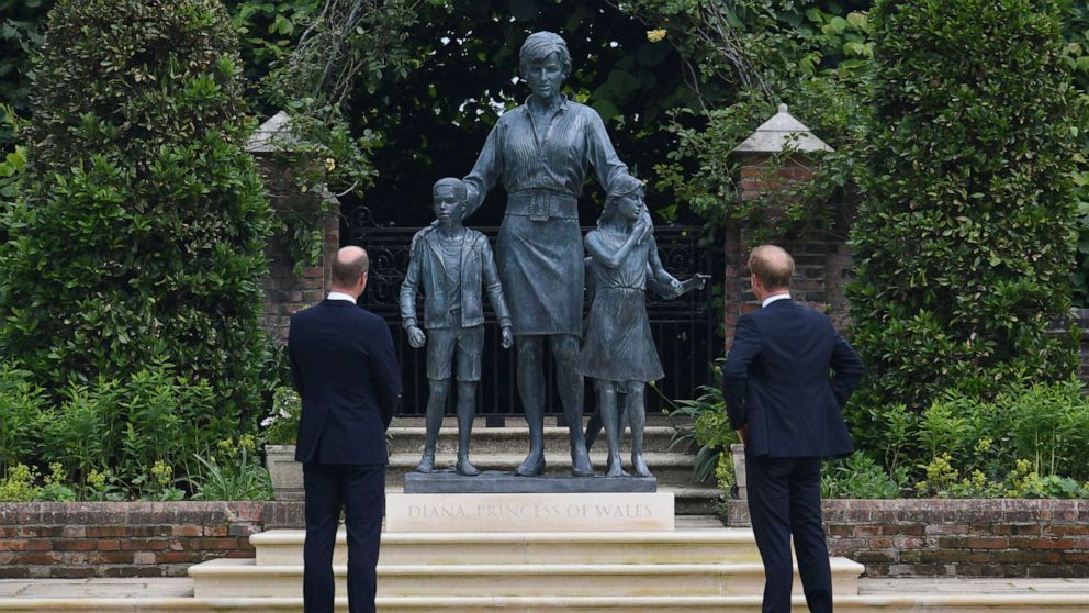 PHOTO: Britain's Prince William and Prince Harry look at the staue they commissioned of their mother Princess Diana, on what woud have been her 60th birthday, in the Sunken Garden at Kensington Palace, London, July 1, 2021.