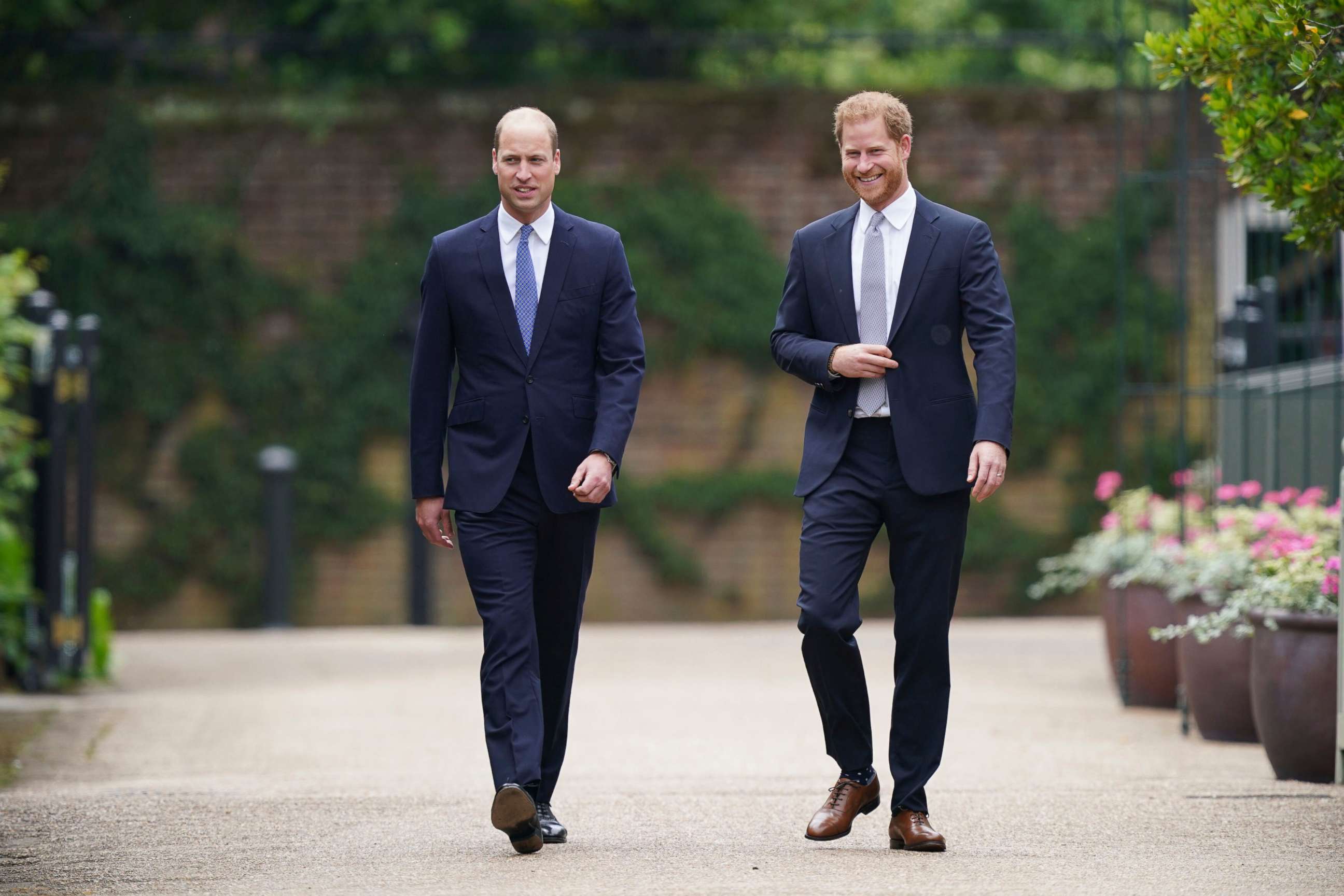 PHOTO: Britain's Prince William and Prince Harry arrive for the statue unveiling on what would have been Princess Diana's 60th birthday, in the Sunken Garden at Kensington Palace, London, July 1, 2021.