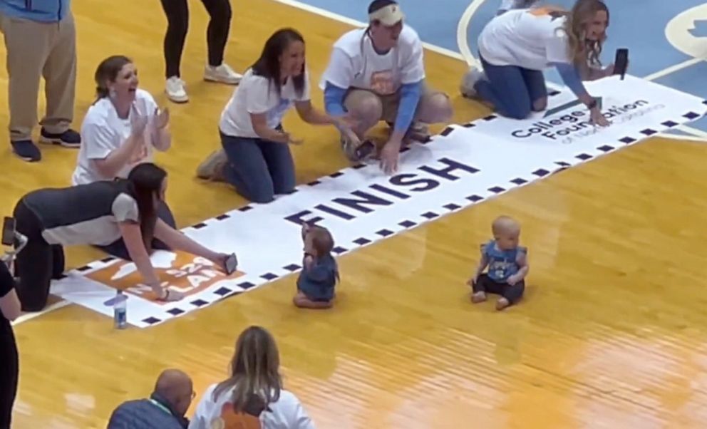 PHOTO: Babies compete in the "Diapers to Dorms Dash" at the March 4, 2023, basketball game between Duke University and the University of North Carolina in Chapel Hill.