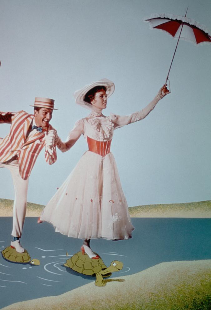 PHOTO: Dick Van Dyke and Julie Andrews cross a river using turtles as stepping-stones in a scene from "Mary Poppins," directed by Robert Stevenson, in 1964. 