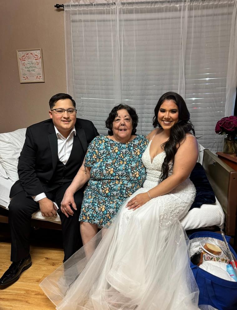 PHOTO: Dinahlee Nava and her husband Alan Nava pose for a photo with Nava’s grandmother Magdalena Gonzalez.