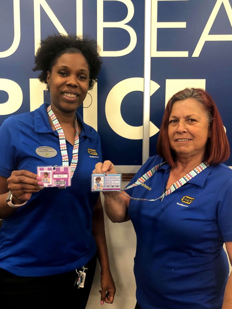 PHOTO: Best Buy employees T and Stephanie sporting their new "Dino Doctor" Best Buy badges.