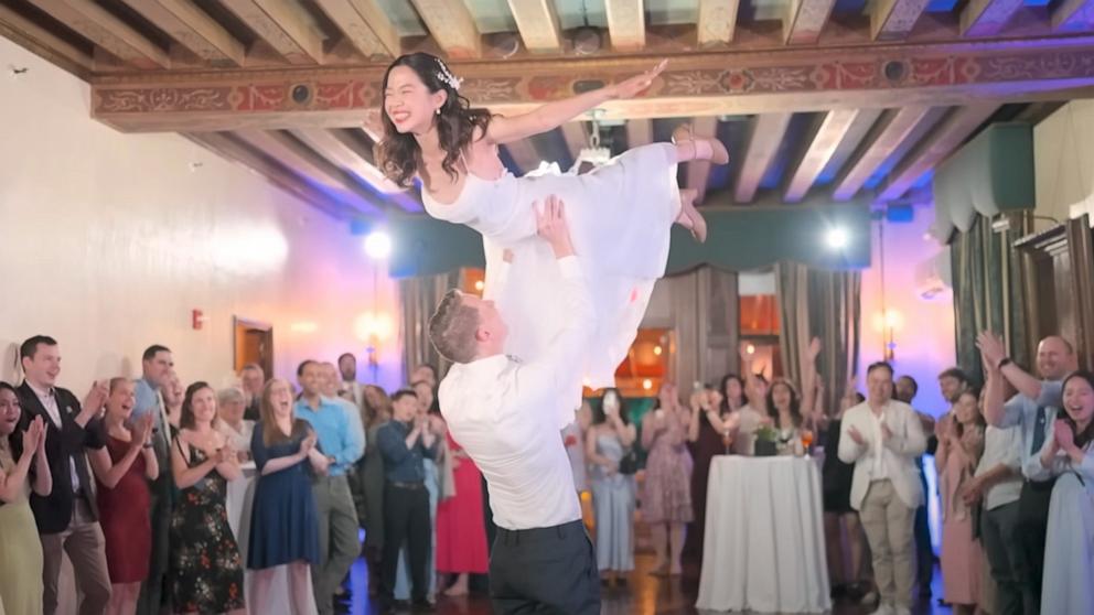 PHOTO: Chris and Lan Donais re-creating the famous lift movie from “Dirty Dancing” at their August 2024 wedding reception.