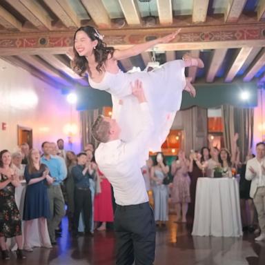 PHOTO: Chris and Lan Donais re-creating the famous lift movie from “Dirty Dancing” at their August 2024 wedding reception.