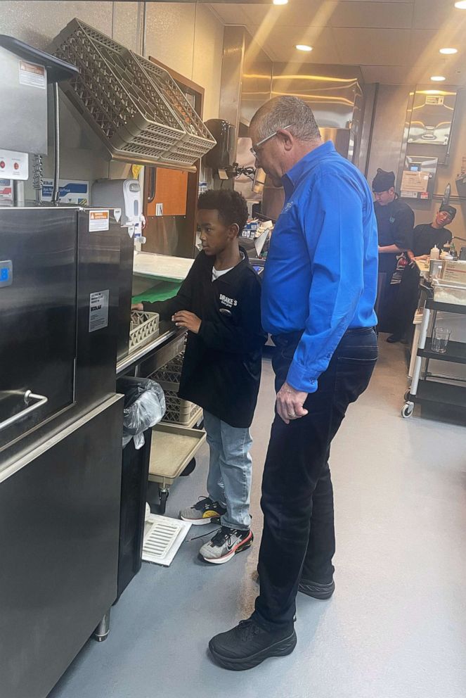 PHOTO: Mark Thornburg, the chief operating officer at Drake's, showed Nash what the restaurant's dish machine looked like and how it worked.