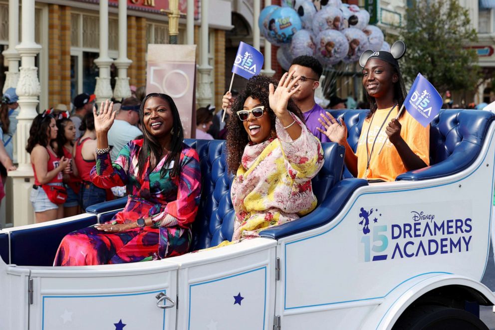 PHOTO: Kelly Rowland and Tracey Powell wave to fans during a parade at Walt Disney World Resort in Lake Buena Vista, Fla., March 03, 2022.