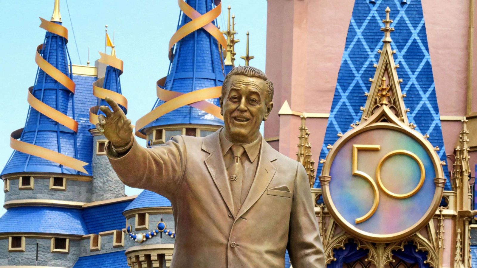 PHOTO: The sculpture of Walt Disney in front of Cinderella Castle in the Magic Kingdom at Walt Disney World, in Lake Buena Vista, Fla., July 23, 2021. The long-awaited 50th Anniversary crest was debuted on the front of the iconic castle.