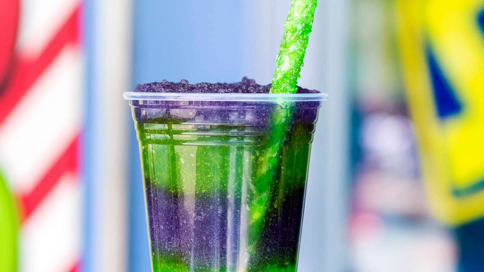 PHOTO: Disney's Space Ranger Slush conains layers of purple grape and green apple slush with a green rock candy straw.