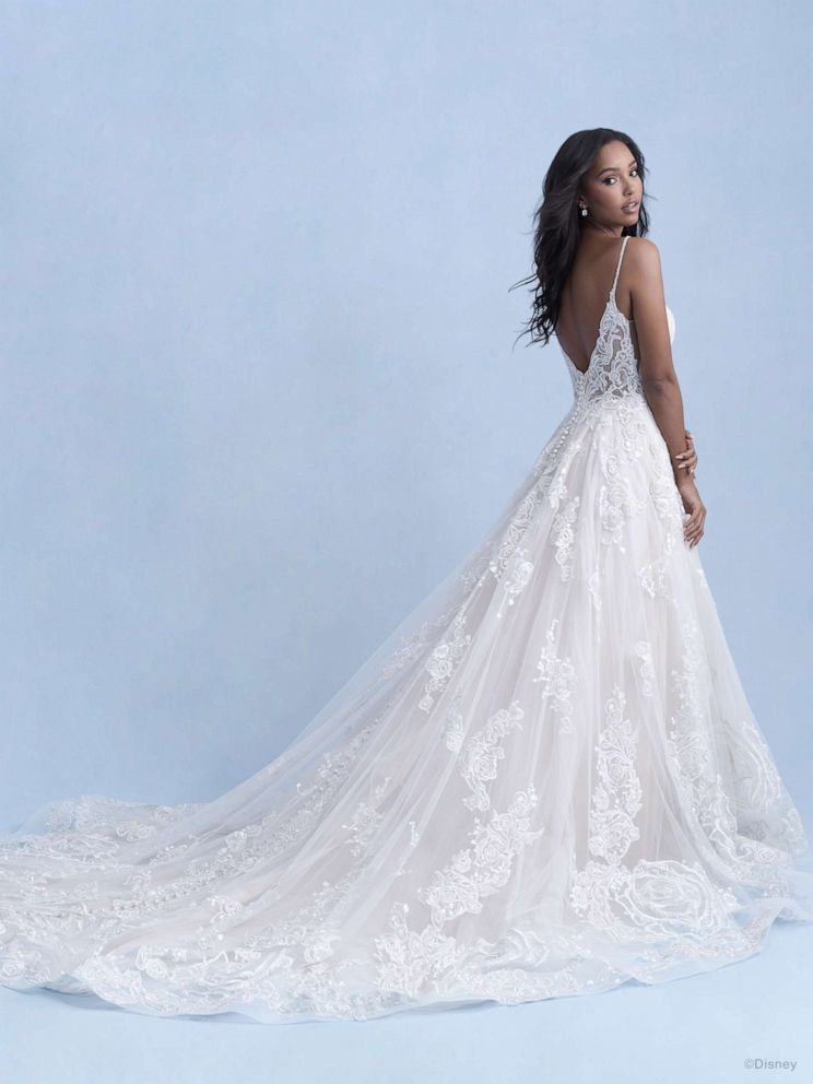 PHOTO: Model wears the Mainline Belle dress from the 2021 Disney Fairy Tale Weddings Collection, which includes rose motifs, an embroidered lace overlay on the tulle gown and an illusion back.