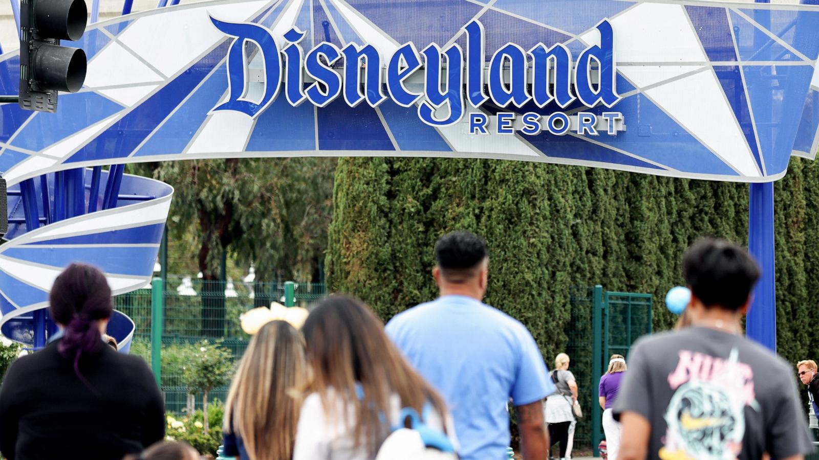 PHOTO: People walk toward an entrance to Disneyland, April 24, 2023, in Anaheim, Calif.