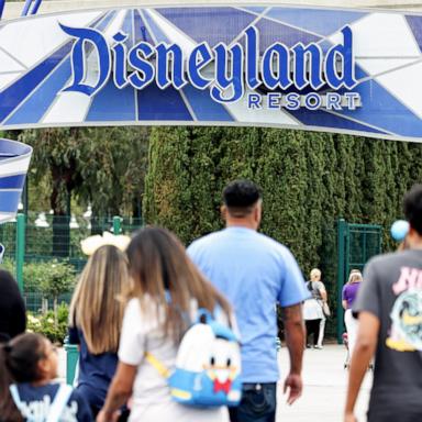 PHOTO: People walk toward an entrance to Disneyland, April 24, 2023, in Anaheim, Calif.