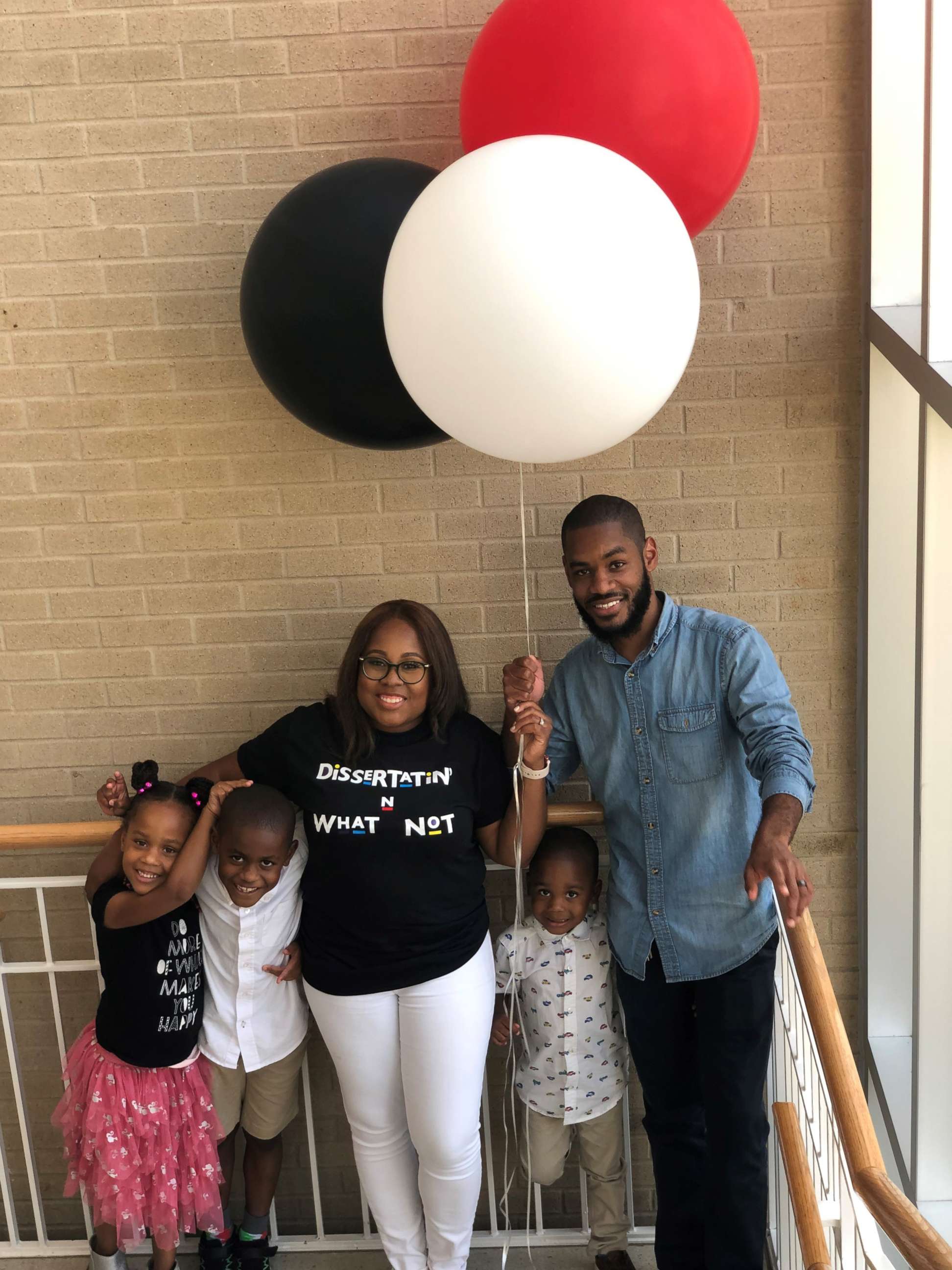 PHOTO: Candace Hall was surprised by her three children after defending her dissertation thesis for a doctorate in education.
